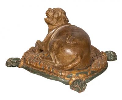 Fine European Carved and Painted Dog Lying on a Pillow