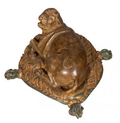 Fine European Carved and Painted Dog Lying on a Pillow