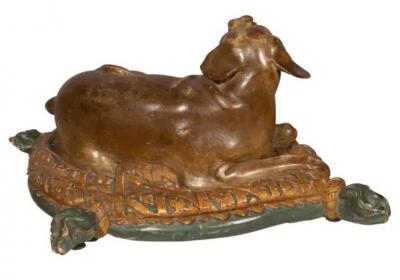 Fine European Carved and Painted Dog Lying on a Pillow