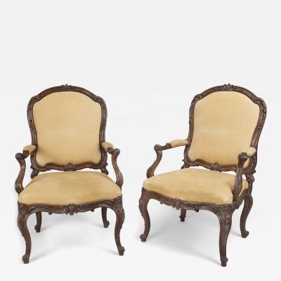 Fine Pair of Carved Walnut Armchairs with Rocaille Ribbons and Flower Motifs