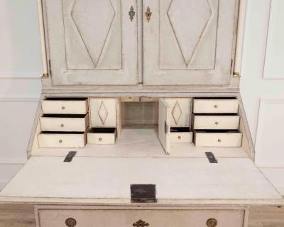 Fine Swedish three part bureau with charming carvings and marble painted columns