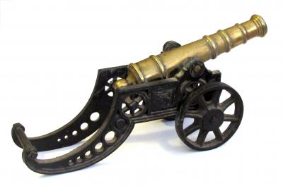 Finely rendered English Victorian brass ornamental cannon on cast iron carriage