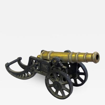 Finely rendered English Victorian brass ornamental cannon on cast iron carriage