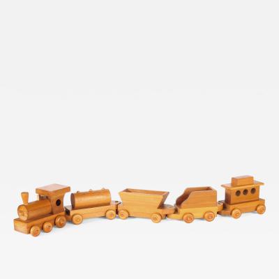 Five piece wooden train set attributed to Montgomery Schoolhouse Vermont