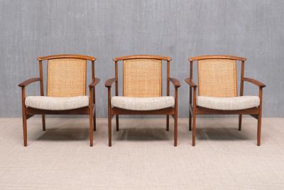 Folke Ohlsson Three Folke Ohlsson Dallas Armchairs in Teak and Cane DUX Sweden 1960s