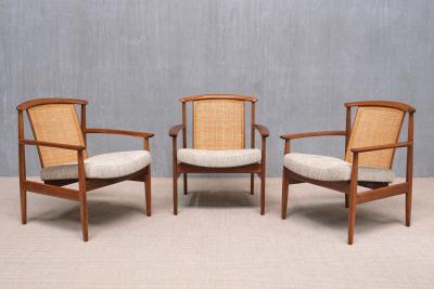 Folke Ohlsson Three Folke Ohlsson Dallas Armchairs in Teak and Cane DUX Sweden 1960s