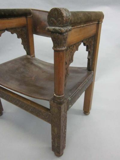 Four Franco Islamic Carved Wood and Leather Lounge Chairs