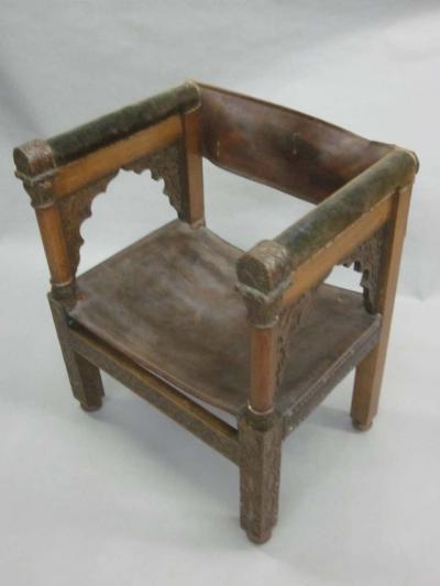 Four Franco Islamic Carved Wood and Leather Lounge Chairs