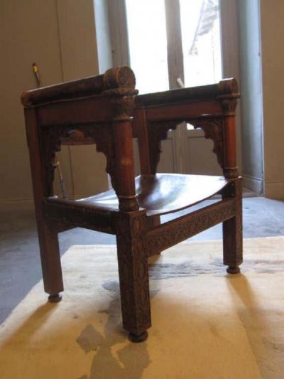 Four Franco Islamic Carved Wood and Leather Lounge Chairs