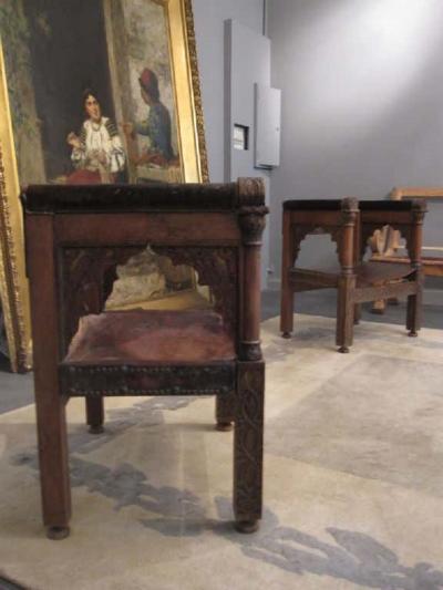 Four Franco Islamic Carved Wood and Leather Lounge Chairs