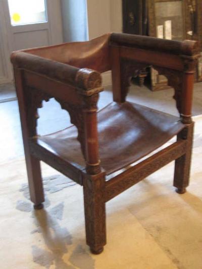 Four Franco Islamic Carved Wood and Leather Lounge Chairs