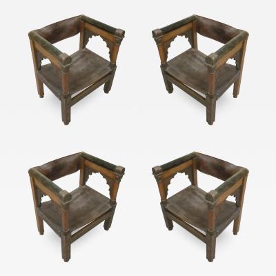 Four Franco Islamic Carved Wood and Leather Lounge Chairs