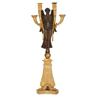 Four French Empire period bronze candelabra