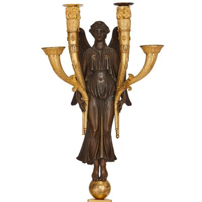 Four French Empire period bronze candelabra