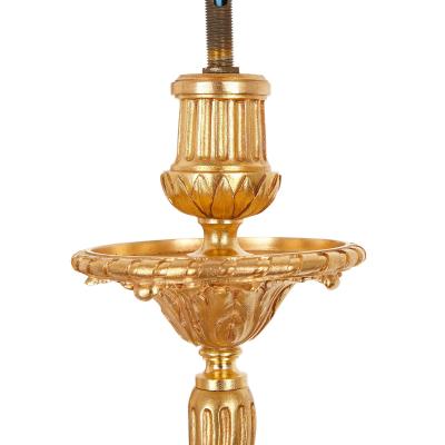 Four Neoclassical style gilt bronze two light sconces