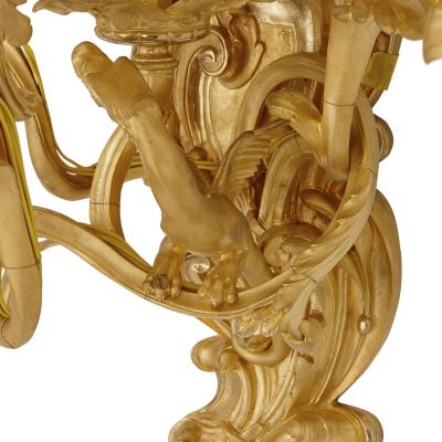 Four antique Rococo style gilt bronze wall sconces
