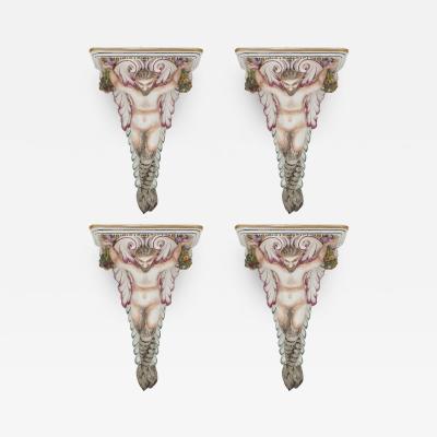 Four decorative porcelain wall brackets of satyr form
