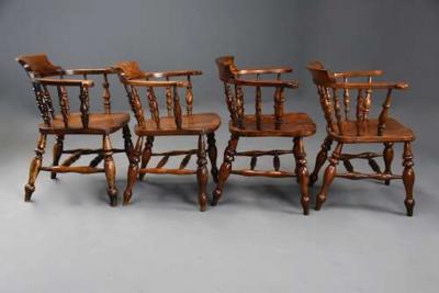 Four mid 19th century smokers bow Windsor or Captain s chairs