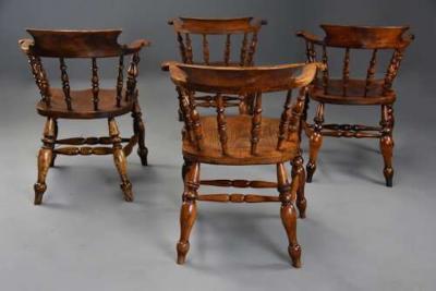 Four mid 19th century smokers bow Windsor or Captain s chairs
