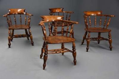 Four mid 19th century smokers bow Windsor or Captain s chairs