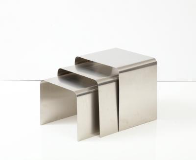 Fran ois Monnet Rare set of three nesting tables rendered in bent brushed stainless steel 