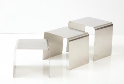 Fran ois Monnet Rare set of three nesting tables rendered in bent brushed stainless steel 