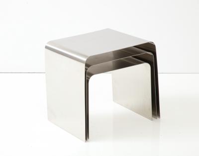 Fran ois Monnet Rare set of three nesting tables rendered in bent brushed stainless steel 