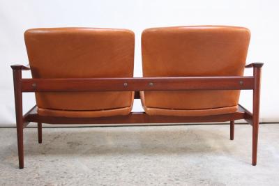 Fredrik Kayser Vintage Norwegian Modern Loveseat in Leather and Teak by Fredrik Kayser