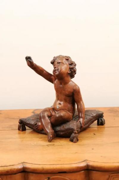 French 1780s Baroque Style Walnut Sculpture of a Putto Sitting on a Pillow