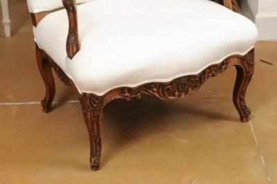 French 1840s Louis XV Style Walnut Fauteuil with Carved Accents and Upholstery