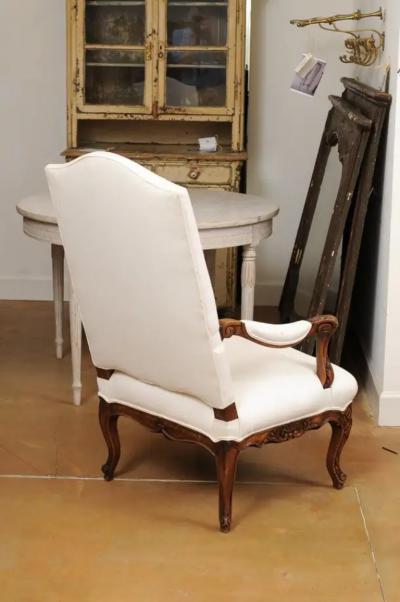 French 1840s Louis XV Style Walnut Fauteuil with Carved Accents and Upholstery