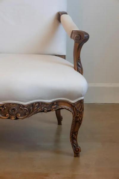 French 1840s Louis XV Style Walnut Fauteuil with Carved Accents and Upholstery