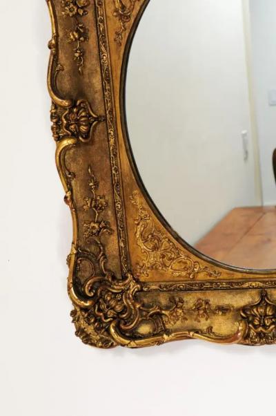 French 19th Century Carved Giltwood Mirror with Scrolling Foliage and Flowers