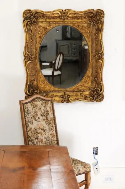 French 19th Century Carved Giltwood Mirror with Scrolling Foliage and Flowers