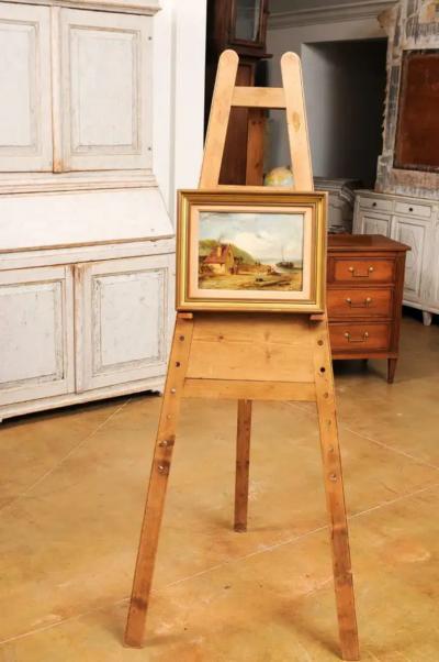 French 19th Century Framed Oil On Panel Painting Depicting a Village by the Sea