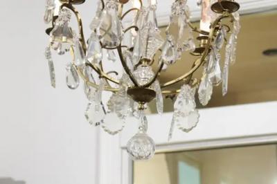 French 19th Century Six Light Crystal Chandelier with Scrolled Brass Armature