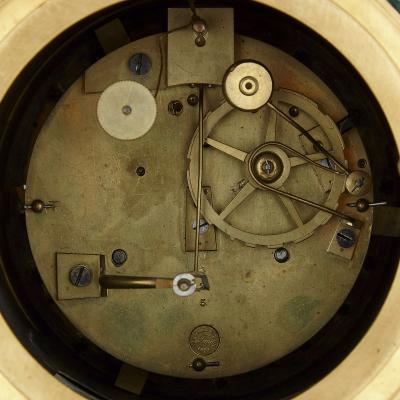 French Charles X malachite lapis lazuli and gilt bronze figurative clock