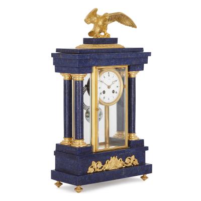 French Empire style lapis and gilt bronze three piece clock set