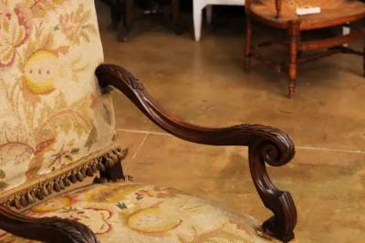 French Louis XIV Style Walnut Fauteuil with Carved Arms and Scrolling Legs