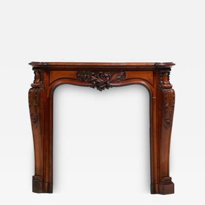 French Louis XV Rococo Walnut Mantel with Hand Carved Floral Reliefs C 1750