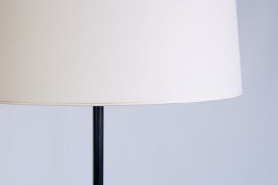 French Modern Three Legged Floor Lamp Black Iron and Ivory Shade 1950s