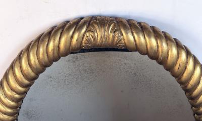 French Napoleon III carved giltwood rope twist oval mirror