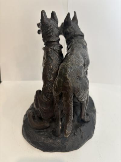 French bronze group of two dogs with one sitting signed Laplanche 