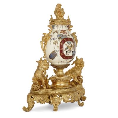 French gilt bronze and faience clock set in the Chinoiserie style
