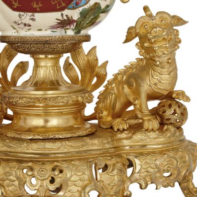 French gilt bronze and faience clock set in the Chinoiserie style