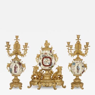 French gilt bronze and faience clock set in the Chinoiserie style