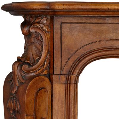 French hand carved walnut fireplace