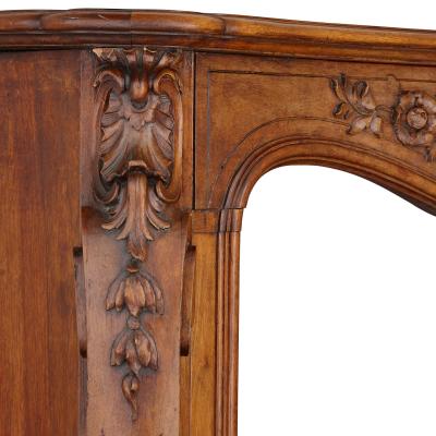 French hand carved walnut fireplace