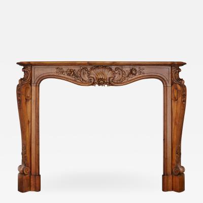 French hand carved walnut fireplace