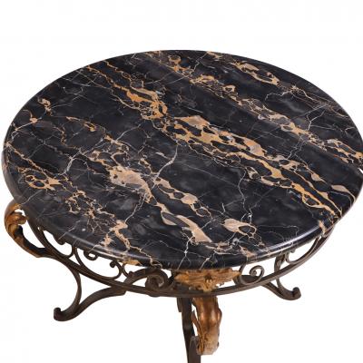 French iron and gilt decorated coffee table with Portoro Nero marble top 